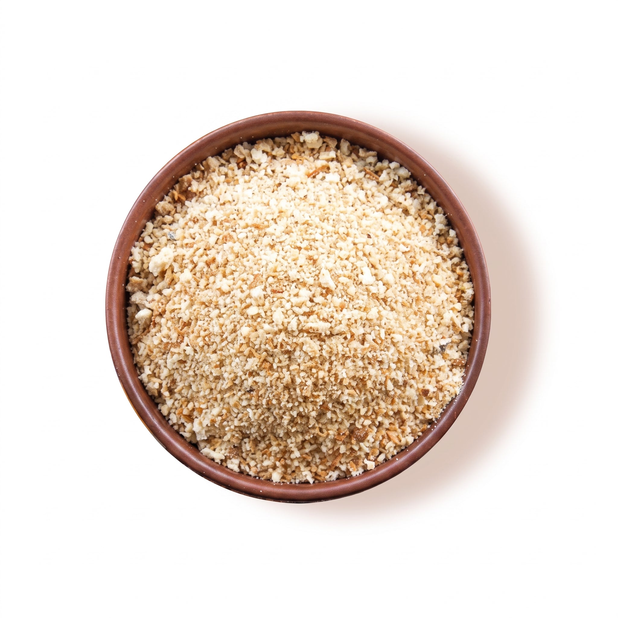 A bowl of breadcrumbs on a white background.