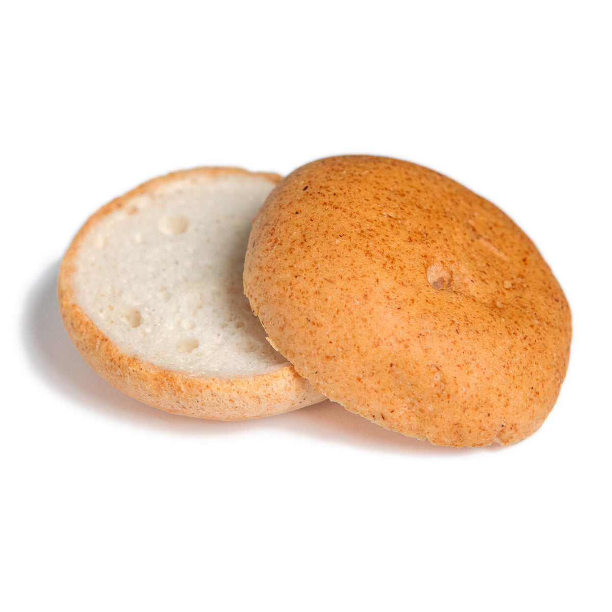 Large white burger bun,  cut open to show the soft white interior with a golden-brown toasted exterior, set against a plain white background.